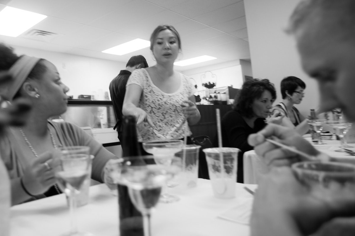Diners at a lunch counter, in black and white