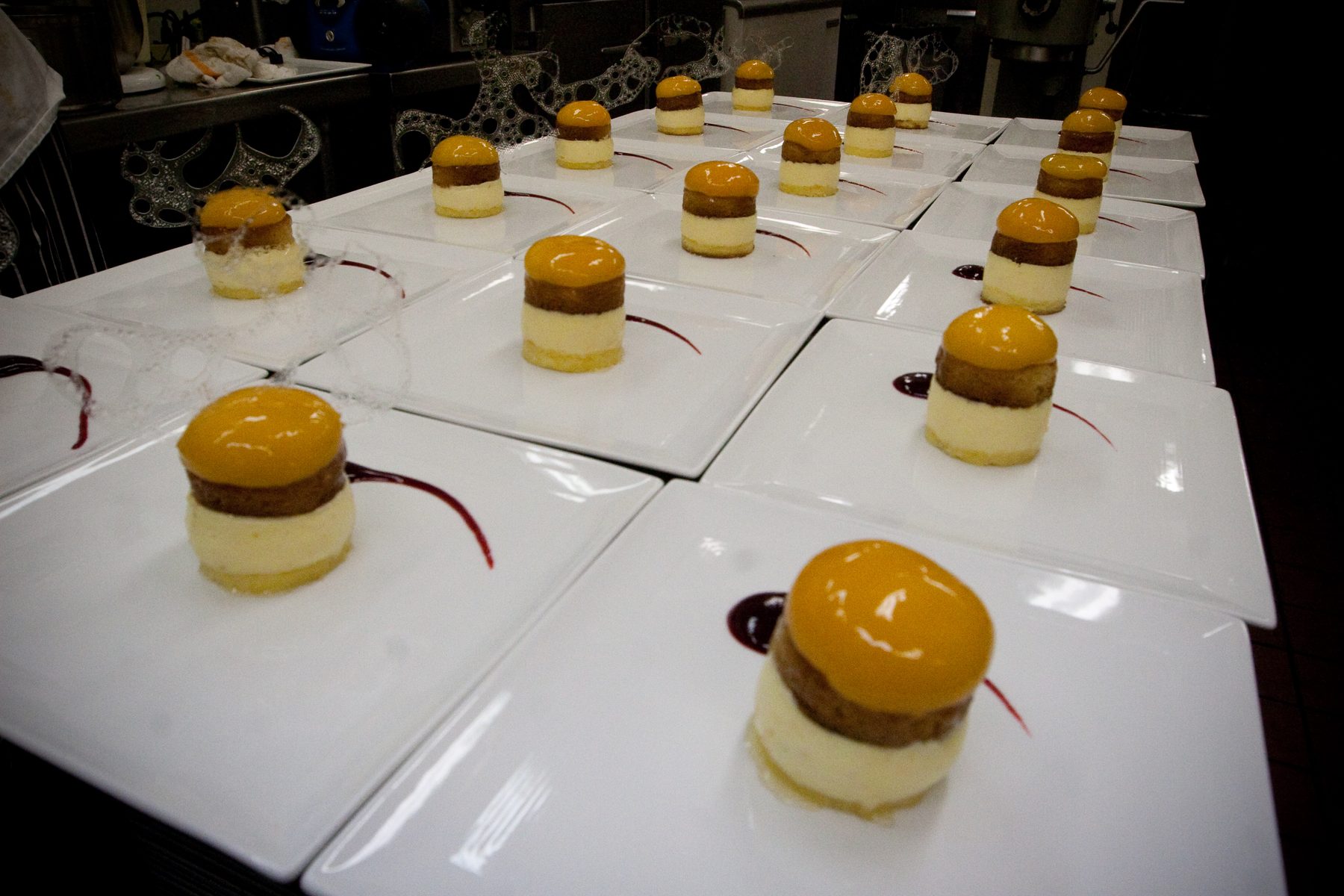 Dessert canapés arranged on white tiles