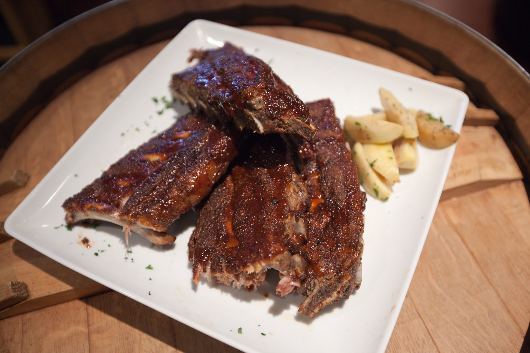 Barbecue ribs on a white plate